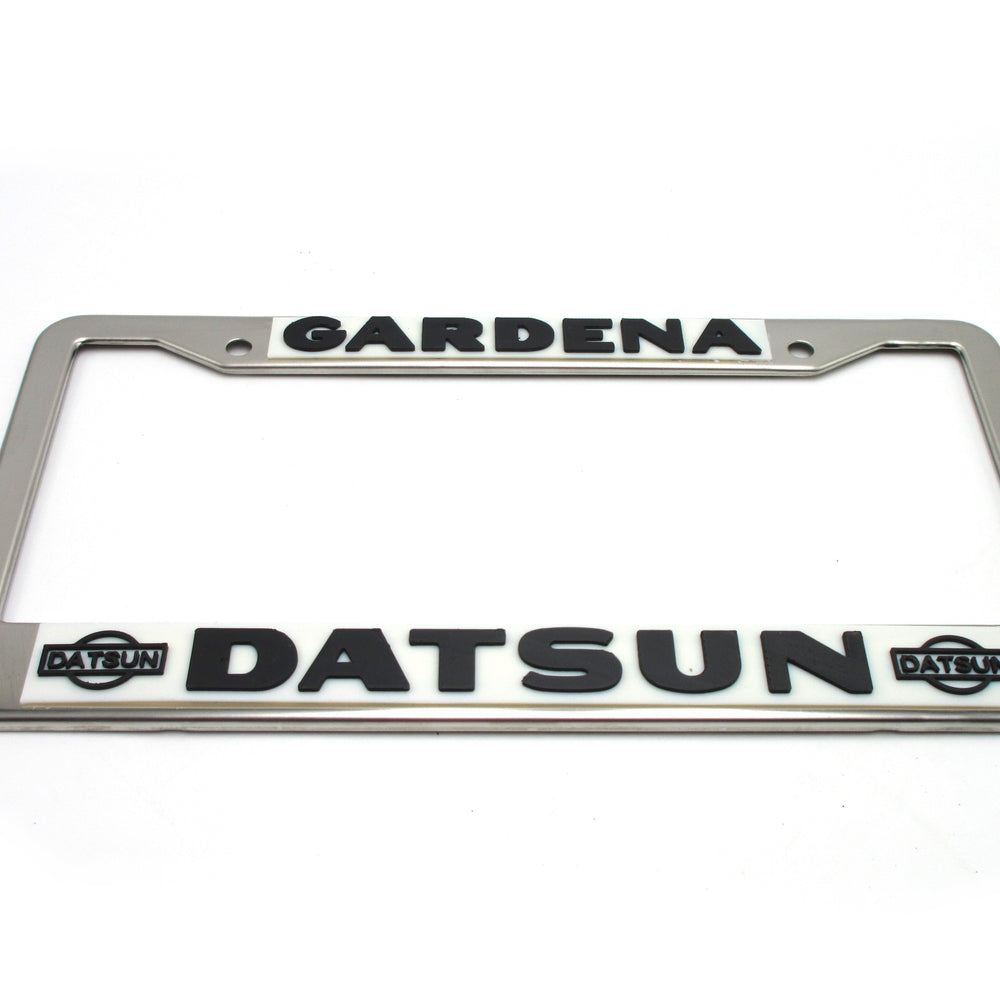 
                      
                        Gardena Datsun License Plate Frame Reproduction
                      
                    