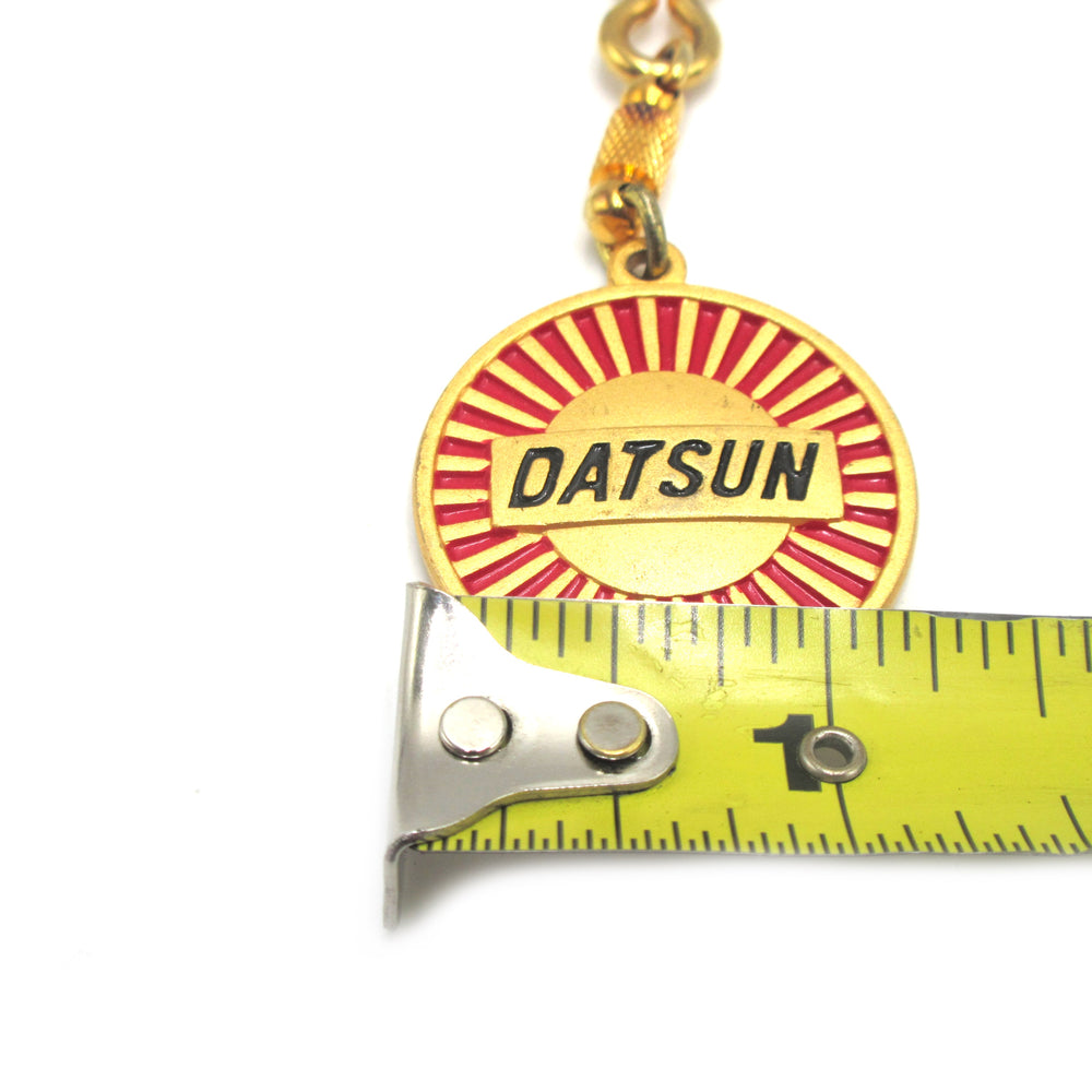 
                      
                        Vintage Datsun Gold Key Chain NOS
                      
                    