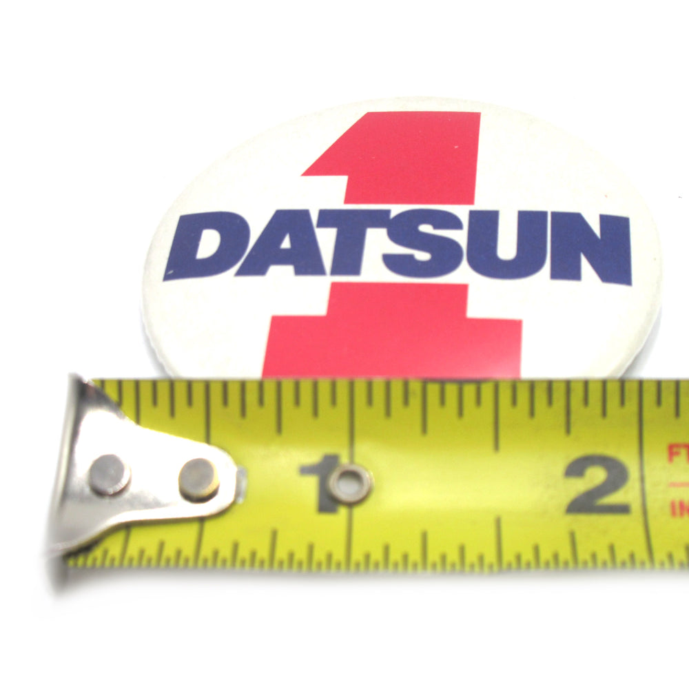 
                      
                        "1 Datsun"  Metal Badge NOS
                      
                    