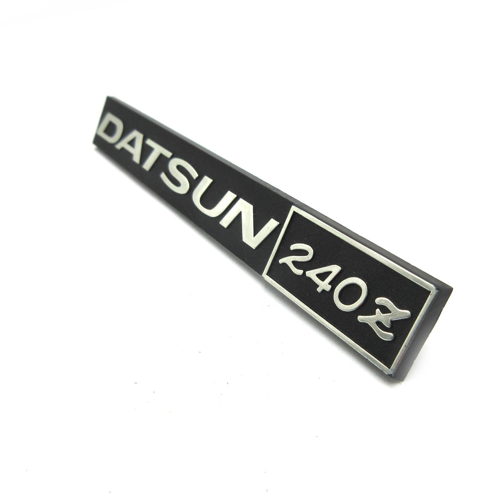 Datsun 240Z Glove Box Emblem Genuine Nissan NOS