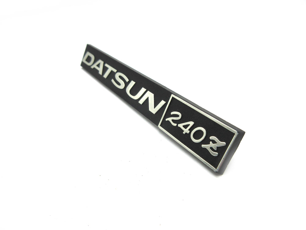 Datsun 240Z Glove Box Emblem Genuine Nissan NOS